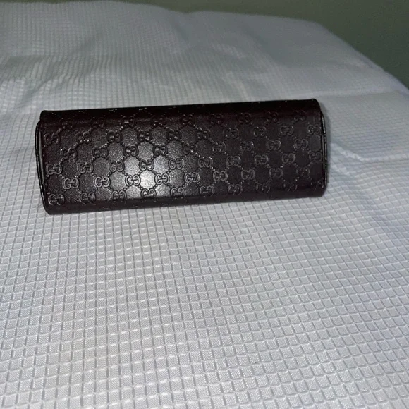 brown leather monogrammed foldable eyeglasses case from Gucci. - Picture 6 of 16